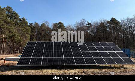 Solar Energy Installation at Forest Edge Sustainable Future Stock Photo