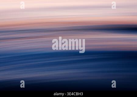 Soft abstract ocean blur with pastel sunset tones Stock Photo