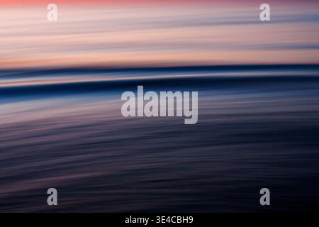Abstract ocean motion blur at sunset with soft pastel tones Stock Photo