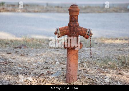 an old hydrant in the street Stock Photo