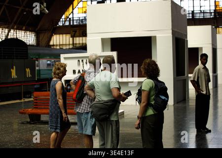 BANGKOK, THAILAND-MAR 15, 2026: Group of senior tourists walking and sightseeing Thai railway history, rear view, at Hua Lamphong. Stock Photo