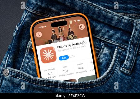Antalya, Turkey - March 24, 2026: Claude AI assistant app shown on smartphone in denim pocket Stock Photo