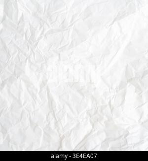 Top view and full frame of wrinkled or crumpled white paper texture is used as crumpled white paper background texture in decorative art work. Stock Photo