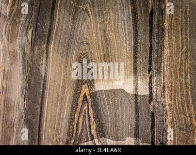 When this granite rock was relieved of its weight by the melting ice shield, it 'bounced' back up. amazing patterns, even formed letters are revealed. Stock Photo
