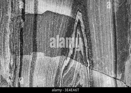 When this granite rock was relieved of its weight by the melting ice shield, it 'bounced' back up. amazing patterns, even formed letters are revealed. Stock Photo