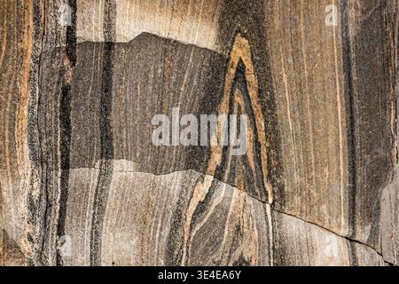 When this granite rock was relieved of its weight by the melting ice shield, it 'bounced' back up. amazing patterns, even formed letters are revealed. Stock Photo