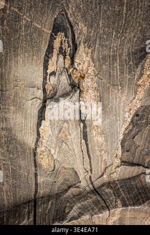 When this granite rock was relieved of its weight by the melting ice shield, it 'bounced' back up. amazing patterns, even formed letters are revealed. Stock Photo