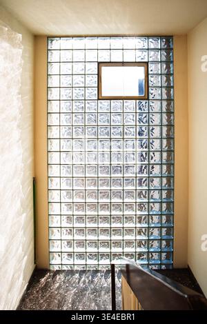 Sunlight filtering through a modern glass block wall. Wide angle view, natural light, no people Stock Photo