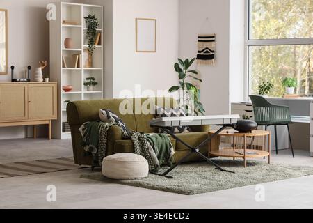 Interior of living room with sofa, glucophone and synthesizer Stock Photo