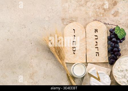 Shavuot holiday offering wheat, milk, cheese, and torah tablets Stock Photo