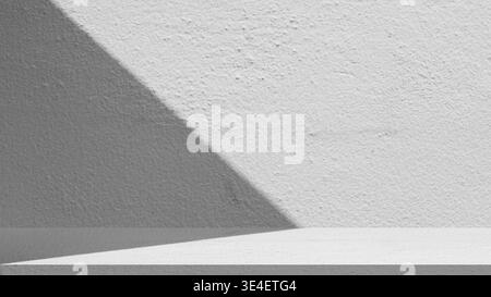 Empty white concrete wall and floor with aesthetic natural shadow for product display mockup. Minimalist studio background with cement texture for sho Stock Photo