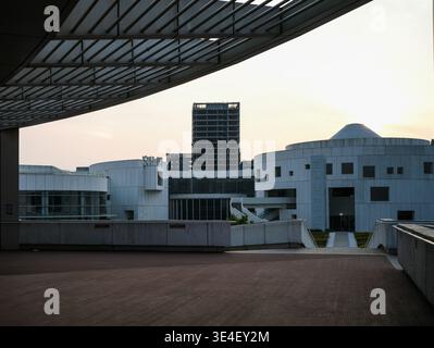Wuhan, China - April 3, 2025: Modern slatted canopy structure overlooking a public plaza and white architectural buildings at Dongxihu Cultural Center Stock Photo