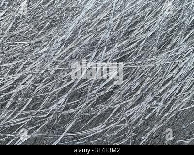 An abstract pattern of random scratches on the steel hull of a fishing boat results in a nice background. Stock Photo