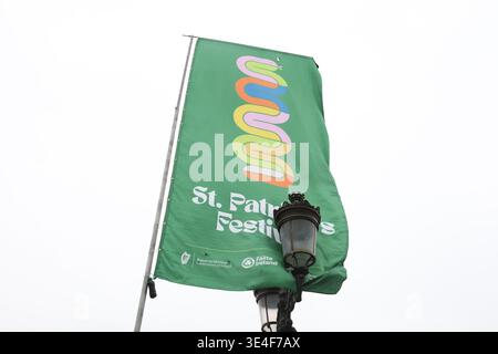 Dublin, Ireland - 18th March 2026: Green Saint Patrick's Festival flag flies beside old lamps on O'Connell Bridge in Dublin city Stock Photo