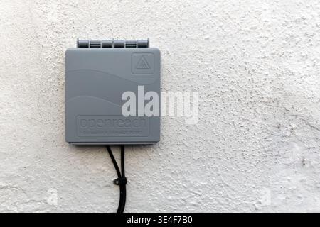 AYR, SCOTLAND - NOVEMBER 24, 2025: Wall mounted Openreach customer service point with fibre broadband cables attached on exterior building wall. Inter Stock Photo