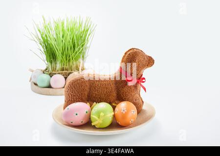 Easter lamb cake with decorated eggs and fresh grass Stock Photo