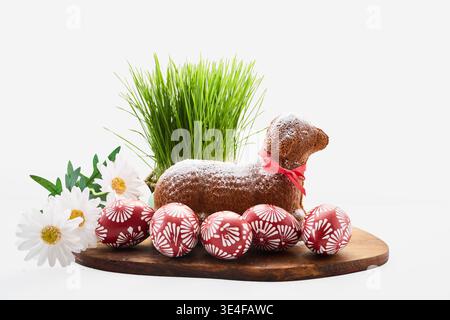 Easter lamb cake with red eggs and green grass Stock Photo
