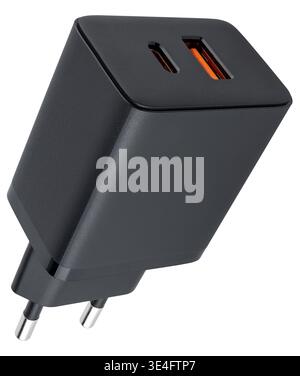 Black phone power adapter with USB port against a plain background Stock Photo