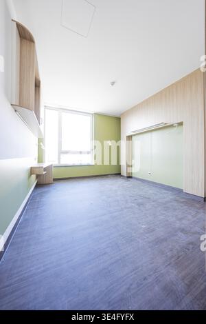 An empty, modern room with green-white walls and large windows, optional patient room in the new hospital, Calw, Germany Stock Photo