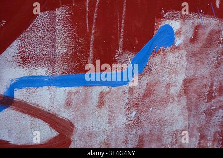 Red blue paint strokes on old white grunge wall background Stock Photo