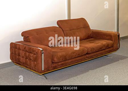 Brown leather upholstery material couch inside empty room interior Stock Photo