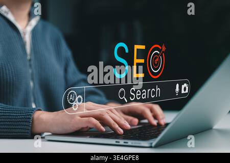 SEO search and AI optimization Concept. Person using laptop with search bar, target icon, smart tools representing search visibility, keyword strategy Stock Photo