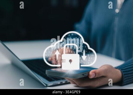 Cloud Security and Data Protection Concept. Woman using smartphone with cloud lock icon, upload, download symbols representing secure cloud storage, Stock Photo