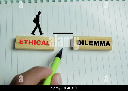 Concept of text ethical dilemma on wooden blocks. Stock Photo