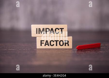 IMPACT FACTOR text written on sticky with pencil and glasses. Stock Photo
