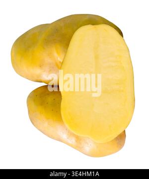 Two tubers of raw potatoes with a half in pile are isolated on white background with clipping path. Stock Photo
