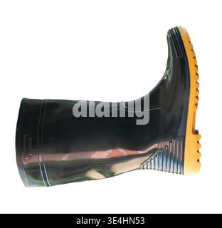 Side view of one side of black gumboot or black boot for working in garden is isolated on white background with clipping path. Stock Photo