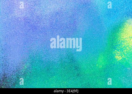 Abstract colored paint texture with soft blurring and speckled grain, blending blue, teal and green tones into a modern illustration background for de Stock Photo