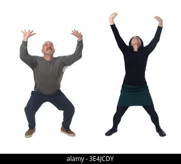 front view of a woman and a man pushing or holding something imaginary Stock Photo