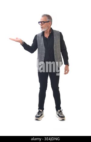 Front view of a man holding something imaginary in the palm of his hand Stock Photo