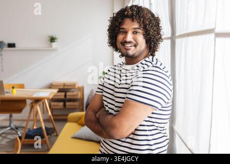 Young Indian man taking selfie at home office Stock Photo