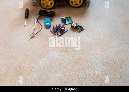 Blur background for copy space text on robotics, assembly and repair of micro components board with diodes. STEM class Stock Photo