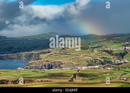 Rainbow Over Green Pastures and Atlantic Cliffs, Sao Miguel Island, Azores Stock Photo