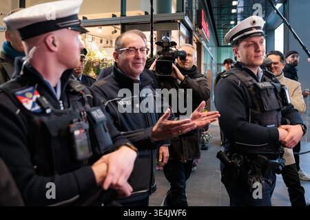 29 March 2026, Berlin: Police officers ride bicycles towards the ...