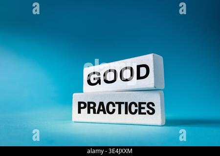 Good business practices. Conceptual words. GOOD PRACTICE on white boards. Beautiful blue background. Copy space. Corporate symbol Stock Photo