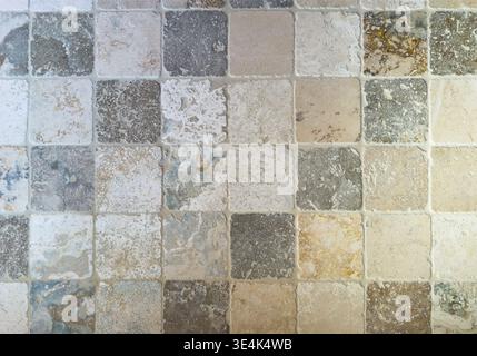 Old stone tiles pattern aged wall texture gray natural background Stock Photo