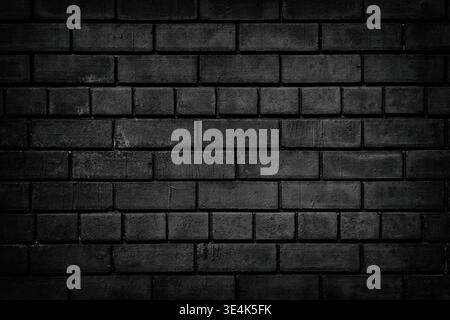 Black brick wall. Dark brickwork texture. Gloomy grunge background Stock Photo