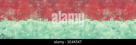 Old shabby blue concrete wall texture with cracked red paint. Wide grunge panoramic background Stock Photo
