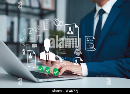 AI Recruitment and Resume Screening for Smart Hiring Process. HR professional using laptop with virtual resume, CV screening, candidate selection, Stock Photo