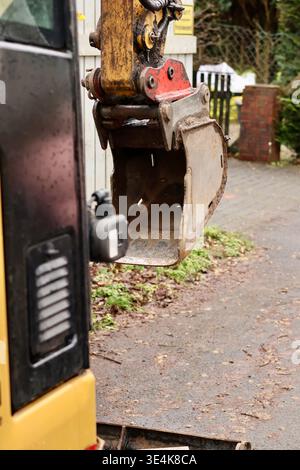 Close-up of a small yellow excavator bucket at a Stock Photo
