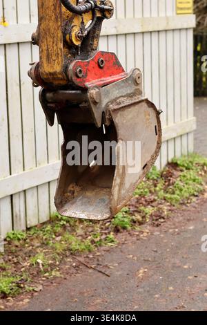 Close-up of a small yellow excavator bucket at a Stock Photo