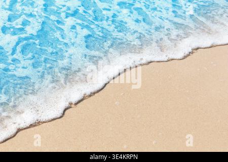 Detailed beach background with foamy turquoise water and smooth sand. Commercially useful minimal image for travel, resort, summer and advertising des Stock Photo