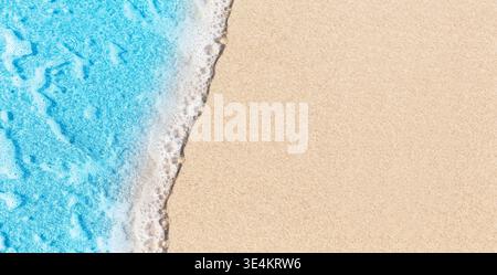 Top view of tropical beach with golden sand and turquoise sea waves. Minimal summer background with copy space, perfect for travel and vacation design Stock Photo