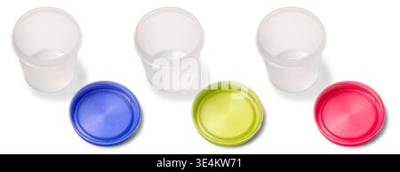 set of empty translucent plastic containers isolated white background, detached blue yellow and red lids, top view of organization concept Stock Photo