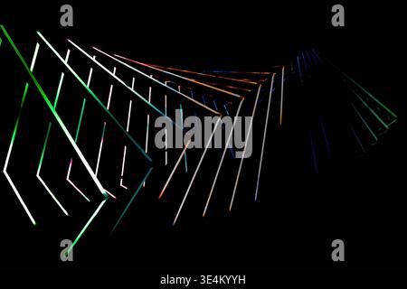 Overlapping glowing frames and linear elements in multiple colors form a layered abstract pattern on black. Stock Photo