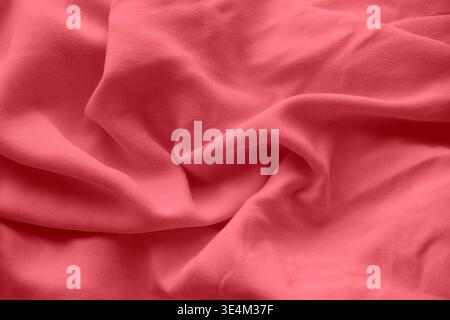 Soft pink fabric with elegant ripples and smooth texture. Close up. Stock Photo